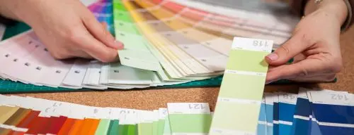 Close-up of colour cards on a designer's desk