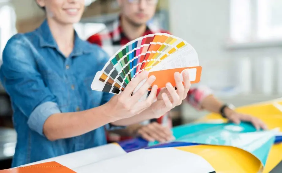 Designers choosing colours from a swatch fan